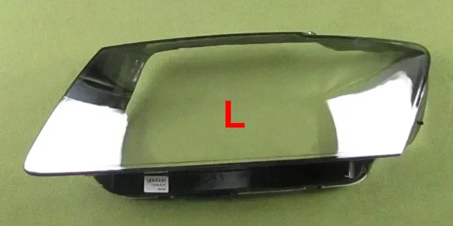 Car headlight cover with 'L' marking on a green background
