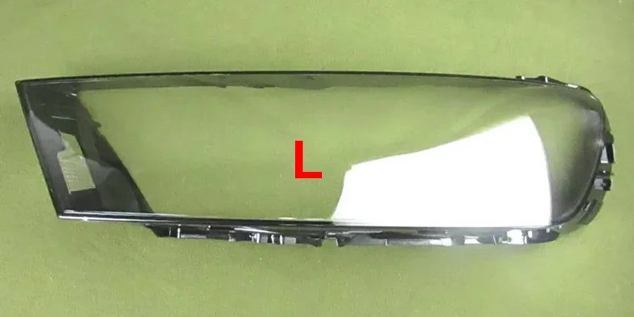 Car headlight cover with a white piece and red 'L' label on a green background