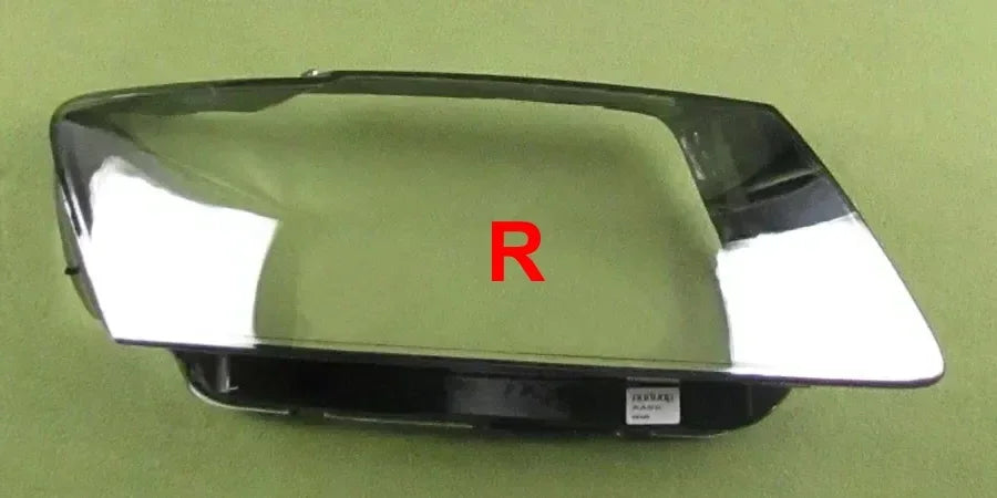 Car headlight cover with 'R' marking on a green background
