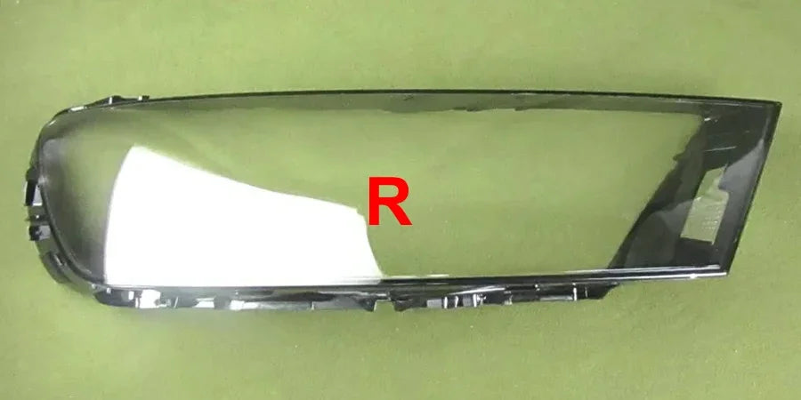 Car headlight cover with 'R' marking on a green background