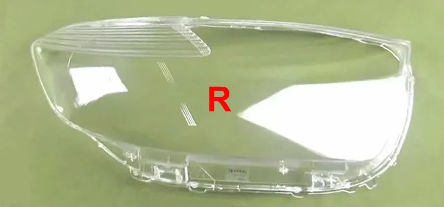 Clear car headlight cover with 'R' marking on a green background