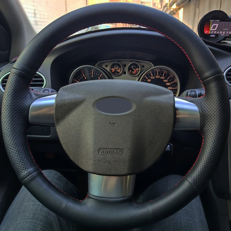 Steering wheel and dashboard of a car with visible airbag label