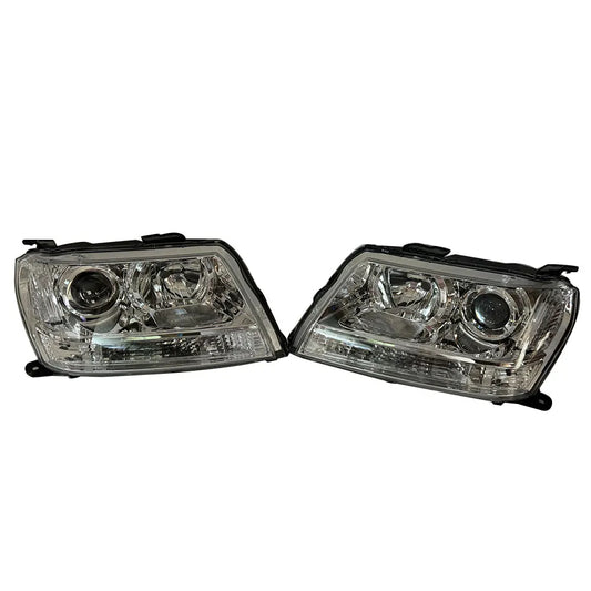 Pair of car headlights on a white background