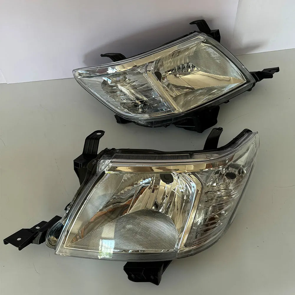 Two car headlights on a white background