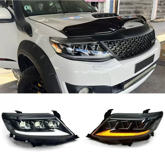 White SUV with black car hood and headlights, showing close-up of headlights on a white background.