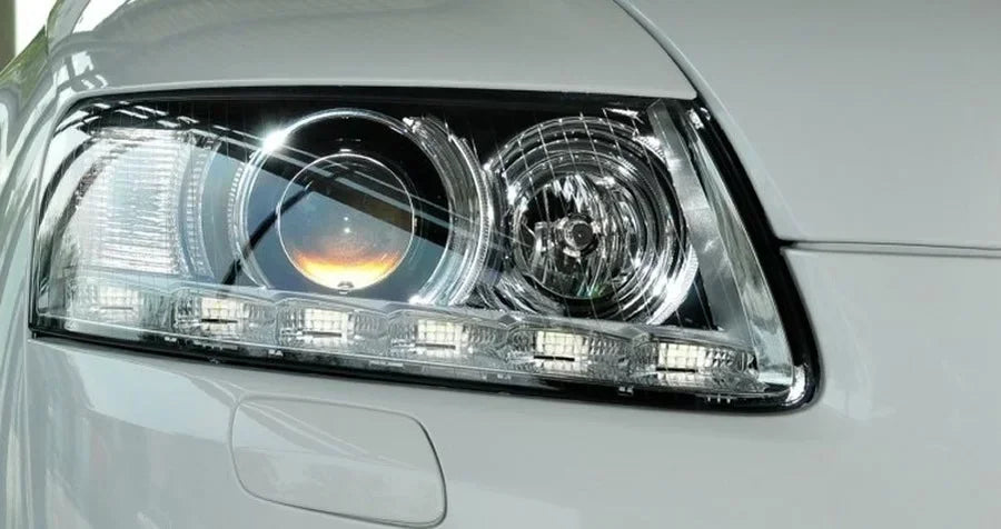 Close-up of a car headlight with a clear lens