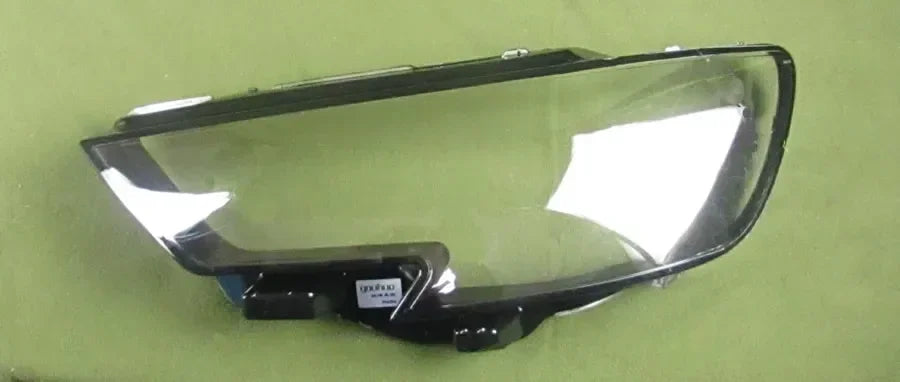 Car headlight assembly on a green background