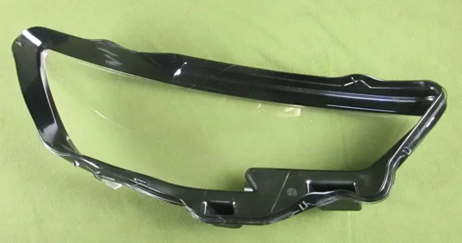 Black car bumper on a green background