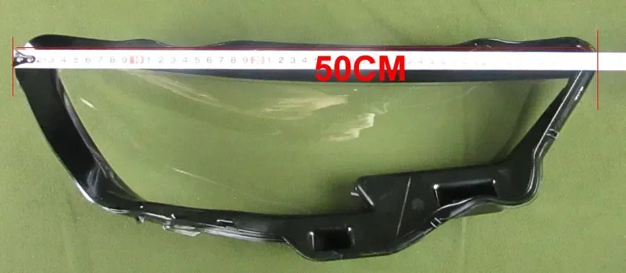 Black car bumper with a measuring tape indicating 50cm on a green background