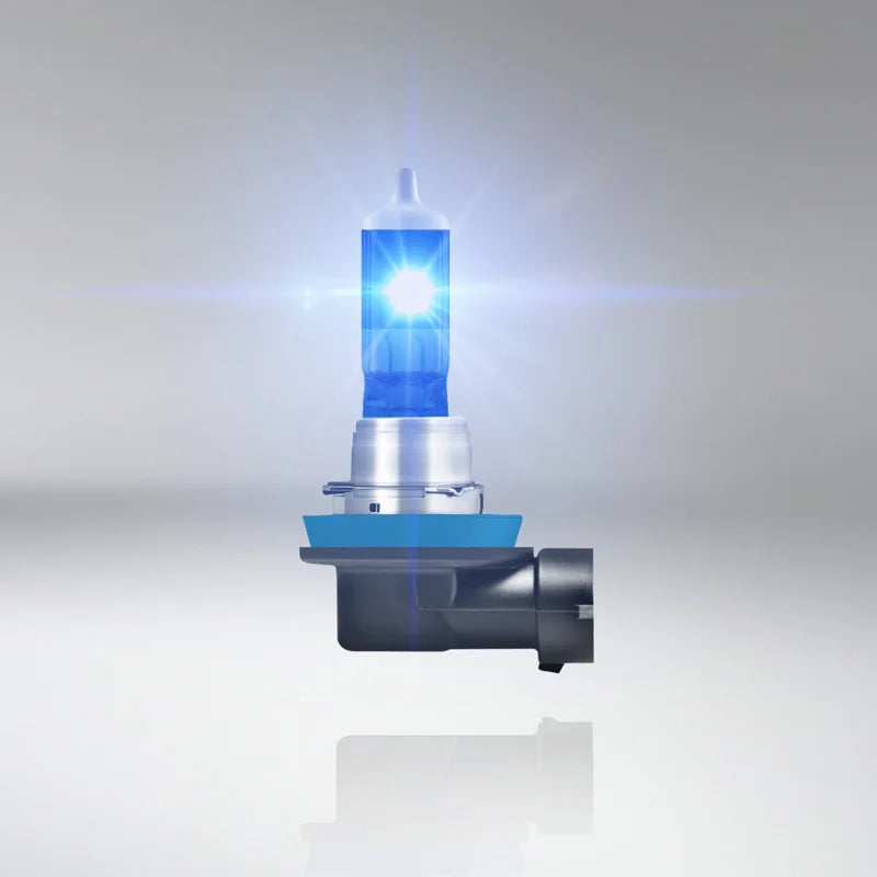 Car headlight bulb with blue tint on a gray background