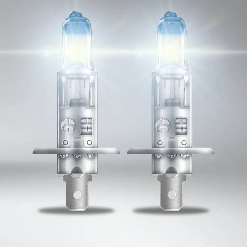 Two car headlights on a gray background