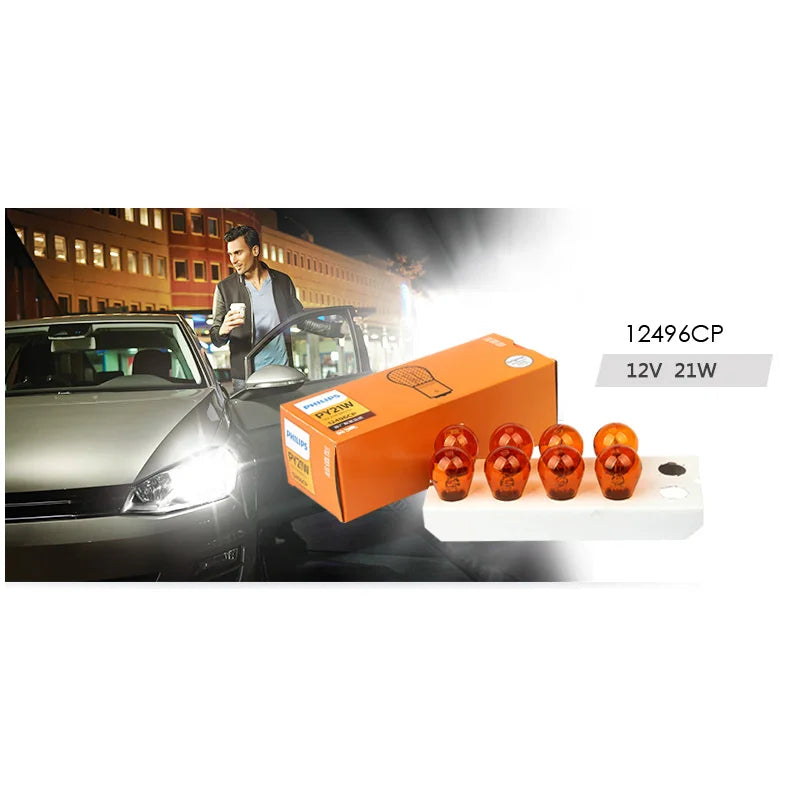 Car headlights with a box of orange car bulbs on a white background