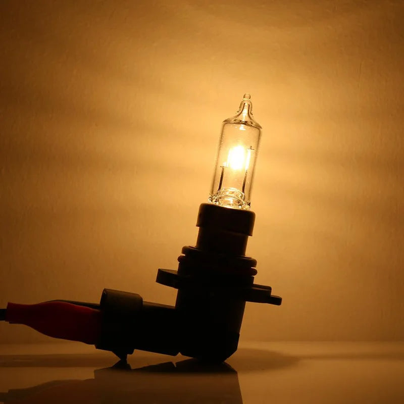 Car headlight bulb with a warm glow on a brown background