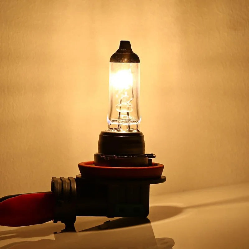 Vintage-style light bulb on a wooden base against a warm beige background