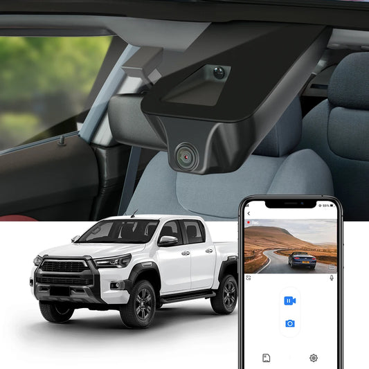 Car interior with a camera mounted on the windshield, smartphone displaying a video feed, and a white truck exterior.