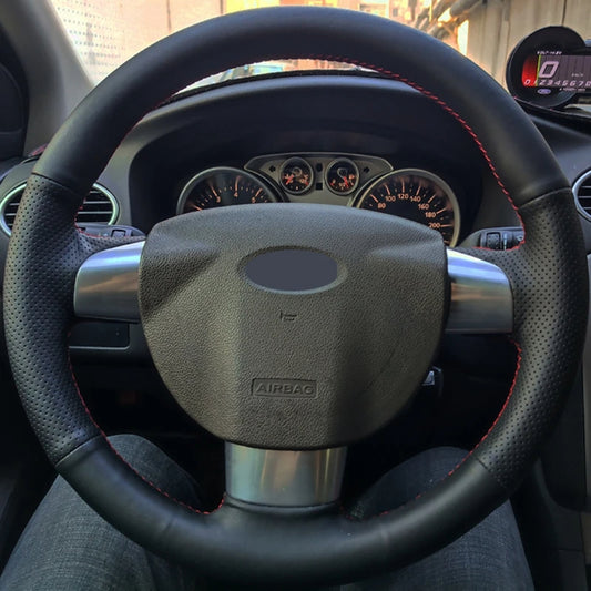 Steering wheel and dashboard of a car with visible airbag label
