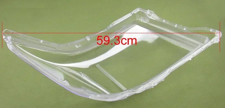 Clear plastic component with measurement label on a green background