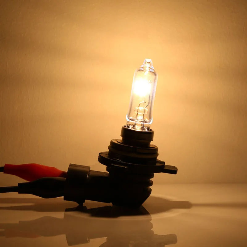Car headlight bulb with wiring on a beige background