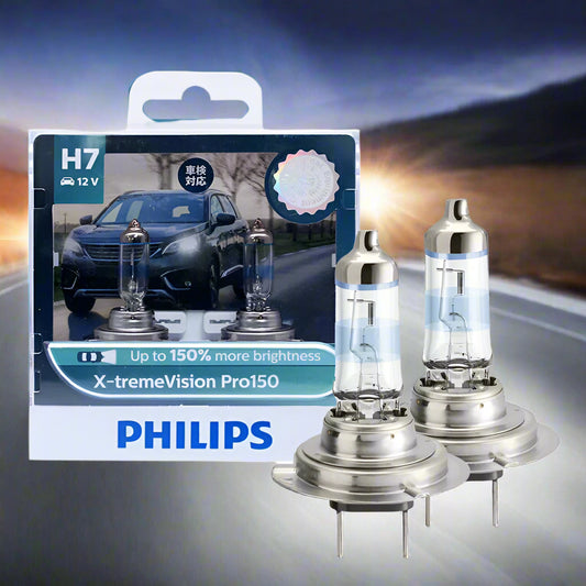 Philips car headlight bulbs with packaging on a white background