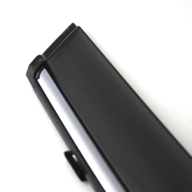 Close-up of a black and silver product with 'Sunz' branding on a white background